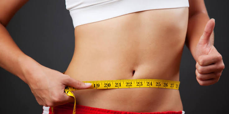 Keto Vera weight loss routine — waist measurement with tape